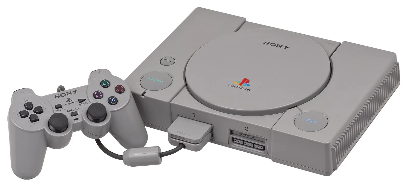 PlayStation original gris con su mando